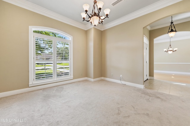 426 Carmargue Ln, Biloxi, MS 39531 - unfurnished room featuring a chandelier, ornamental molding, carpet flooring, arched walkways, and baseboards