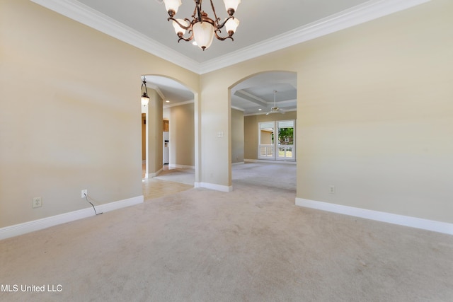 426 Carmargue Ln, Biloxi, MS 39531 - empty room with arched walkways, light carpet, crown molding, baseboards, and a chandelier