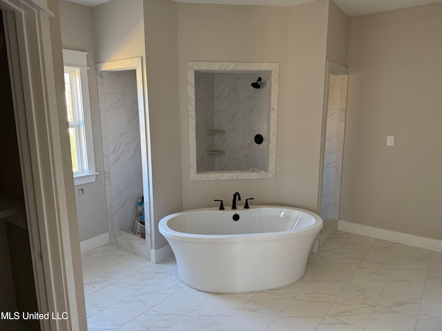 bathroom featuring independent shower and bath