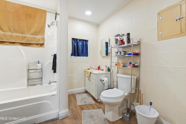 bathroom with toilet, hardwood / wood-style floors, and vanity