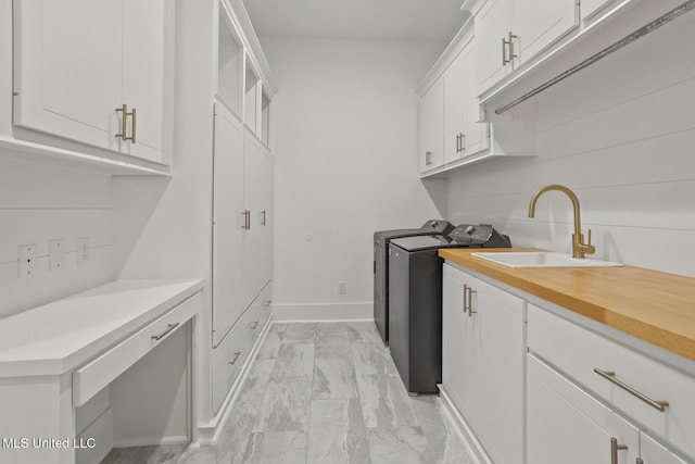 119 Paylors Way, Madison, MS 39110 - washroom featuring washing machine and dryer, light marble finish floors, and cabinet space