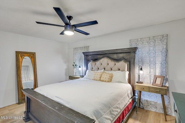 bedroom with light hardwood / wood-style flooring and ceiling fan