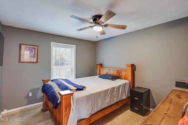 bedroom with hardwood / wood-style flooring and ceiling fan