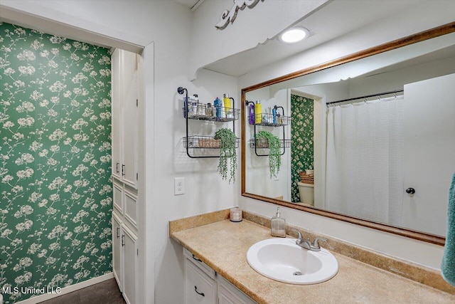 bathroom with vanity and toilet