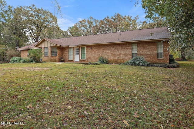 ranch-style home featuring a front yard