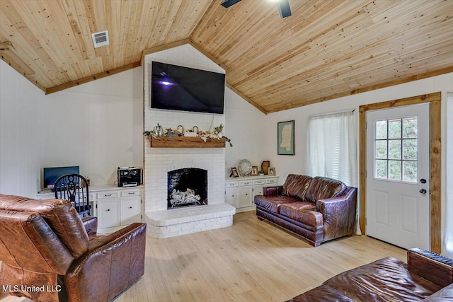 living room with wood ceiling, a brick fireplace, ceiling fan, lofted ceiling, and light hardwood / wood-style flooring