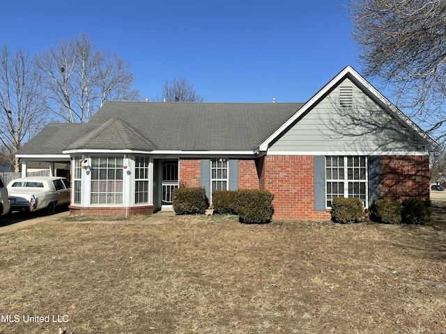 ranch-style house with a front lawn