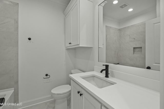 bathroom with vanity, a tile shower, and toilet