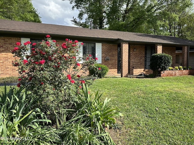 138 William Mckinley Cir, Jackson, MS 39213 - single story home with brick siding and a front yard