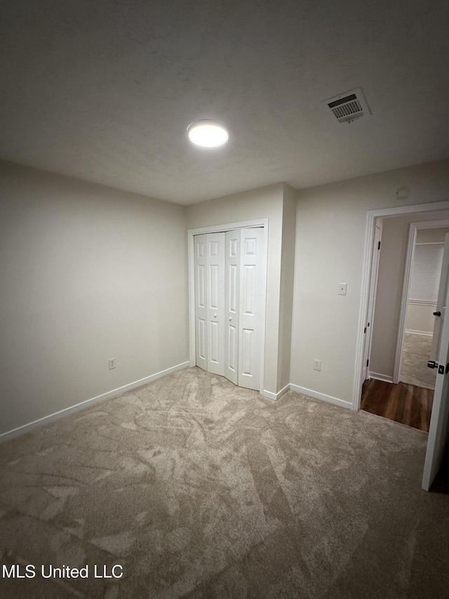138 William Mckinley Cir, Jackson, MS 39213 - unfurnished bedroom featuring carpet, baseboards, and a closet