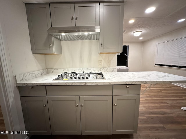 138 William Mckinley Cir, Jackson, MS 39213 - kitchen featuring exhaust hood, gray cabinetry, stainless steel gas stovetop, dark wood-style flooring, and recessed lighting