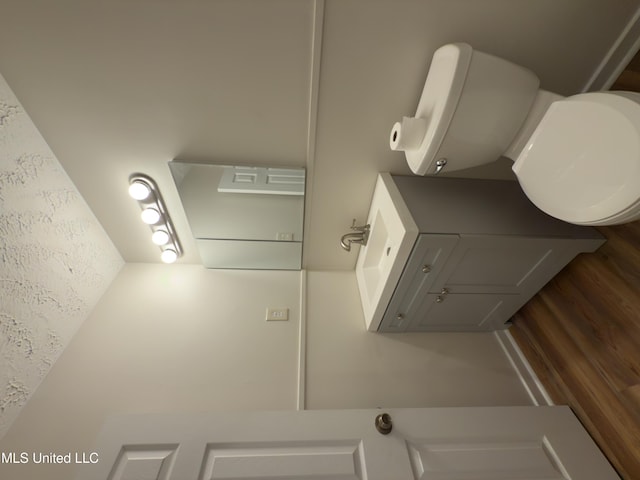 138 William Mckinley Cir, Jackson, MS 39213 - bathroom featuring vanity, wood finished floors, and toilet