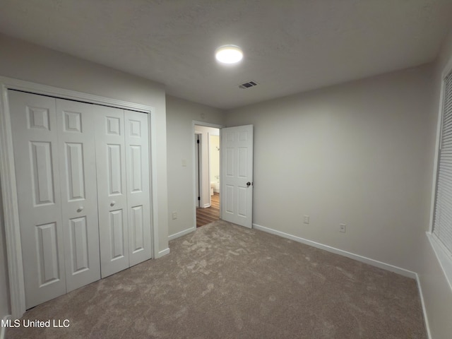 138 William Mckinley Cir, Jackson, MS 39213 - unfurnished bedroom with carpet flooring, baseboards, and a closet