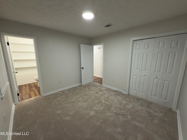 138 William Mckinley Cir, Jackson, MS 39213 - unfurnished bedroom with carpet floors, a closet, baseboards, and ensuite bathroom