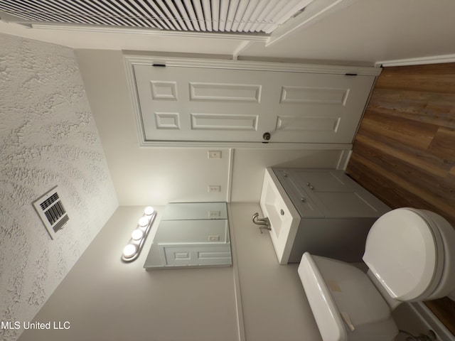 138 William Mckinley Cir, Jackson, MS 39213 - bathroom featuring toilet and wood finished floors