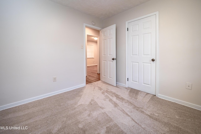 138 William Mckinley Cir, Jackson, MS 39213 - unfurnished bedroom featuring baseboards, carpet flooring, and a textured ceiling