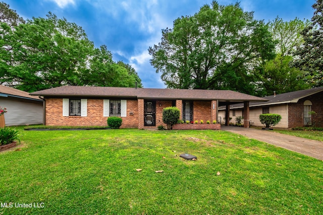 138 William Mckinley Cir, Jackson, MS 39213 - ranch-style home featuring brick siding, concrete driveway, a front yard, and an attached carport