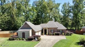 139 Glen Auburn Dr, Clinton, MS 39056 - view of front of home featuring an attached garage and concrete driveway