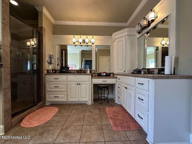 139 Glen Auburn Dr, Clinton, MS 39056 - bathroom featuring a stall shower, tile patterned flooring, vanity, crown molding, and a chandelier