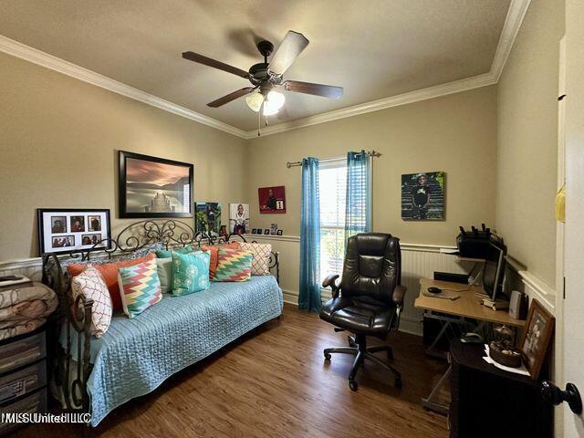 139 Glen Auburn Dr, Clinton, MS 39056 - bedroom with a desk, wood finished floors, ornamental molding, a ceiling fan, and wainscoting