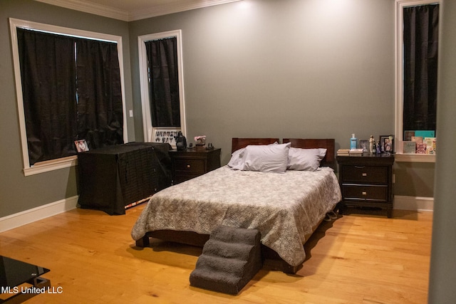 962 Glen Oaks Dr, Pass Christian, MS 39571 - bedroom with wood finished floors, ornamental molding, and baseboards