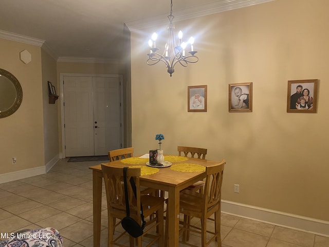 dining space with light tile patterned floors, ornamental molding, a chandelier, and baseboards