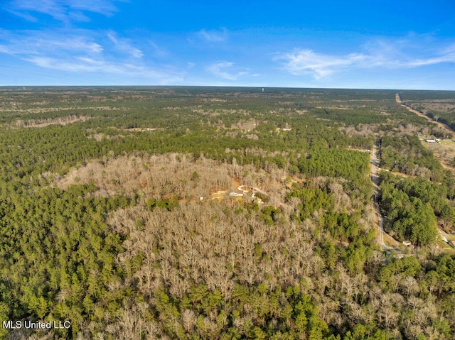 drone / aerial view with a view of trees