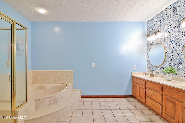 bathroom with vanity, separate shower and tub, a textured ceiling, and tile patterned floors