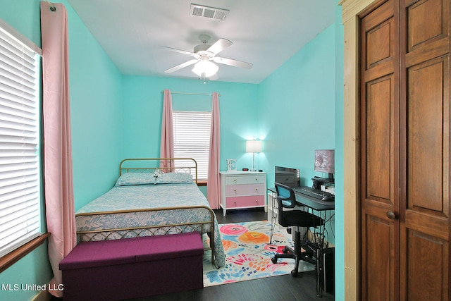 bedroom featuring dark hardwood / wood-style floors and ceiling fan