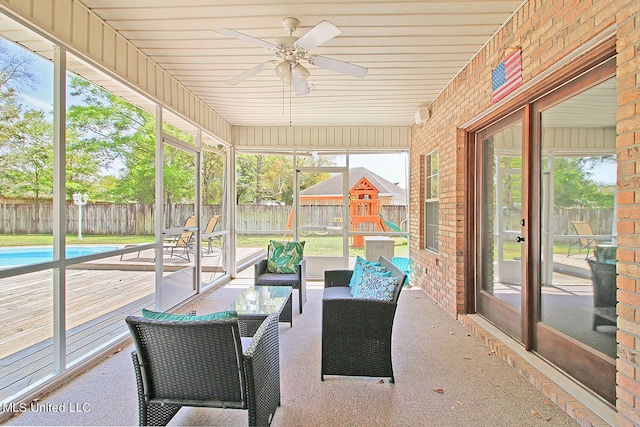 sunroom / solarium with wood ceiling and ceiling fan