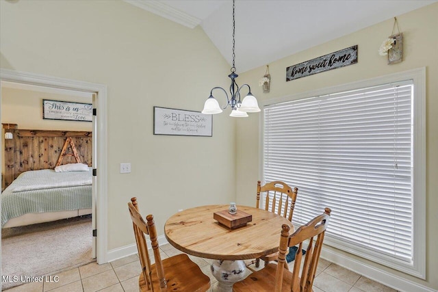 dining area featuring baseboards, light tile patterned floors, an inviting chandelier, and vaulted ceiling