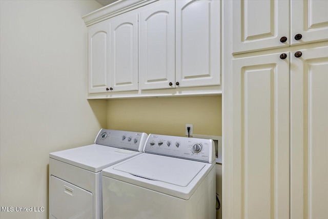 laundry room with cabinet space and independent washer and dryer