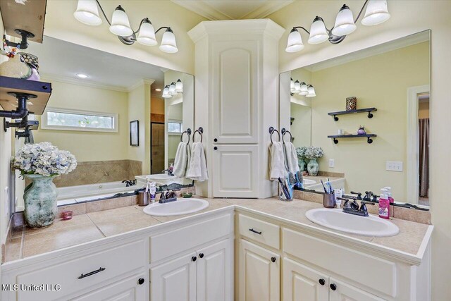full bathroom featuring a bath, double vanity, crown molding, and a sink