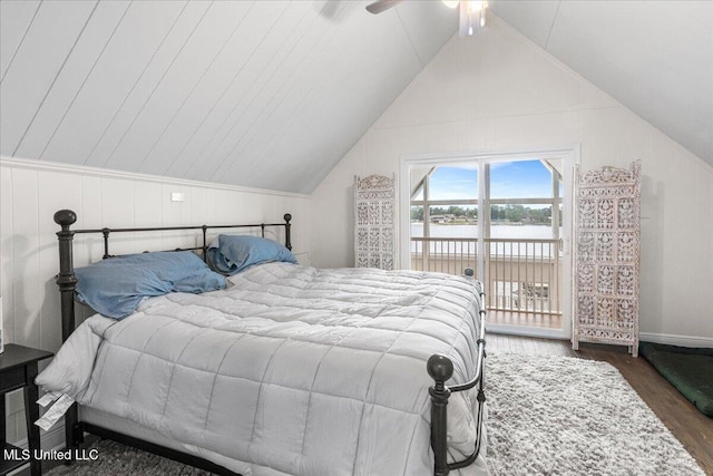 bedroom featuring lofted ceiling, dark hardwood / wood-style floors, access to exterior, and ceiling fan