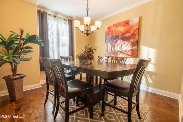dining area featuring a chandelier, baseboards, ornamental molding, and dark wood finished floors