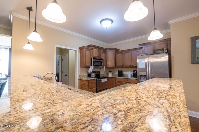 kitchen with a sink, stainless steel appliances, crown molding, light stone counters, and hanging light fixtures