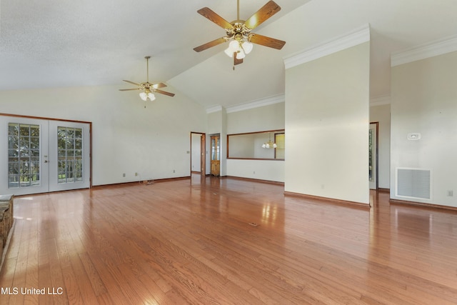 unfurnished living room with french doors, crown molding, vaulted ceiling, ceiling fan, and light wood-type flooring