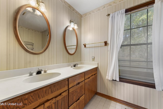 bathroom with tile patterned flooring and vanity