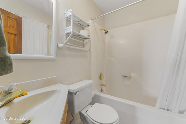 full bathroom featuring toilet, shower / bathtub combination with curtain, and sink