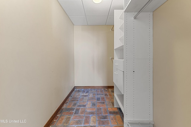 walk in closet featuring a drop ceiling