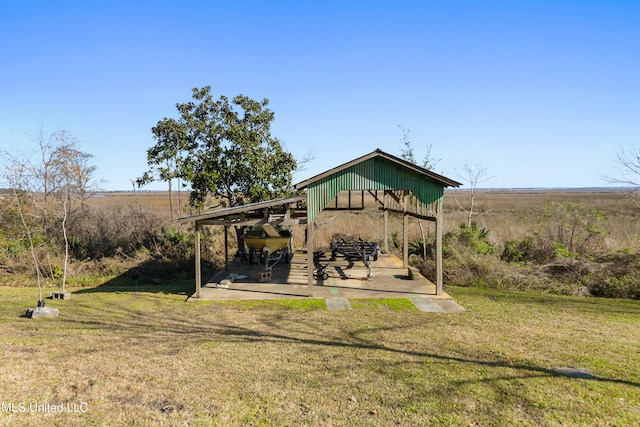 exterior space with a yard and a rural view