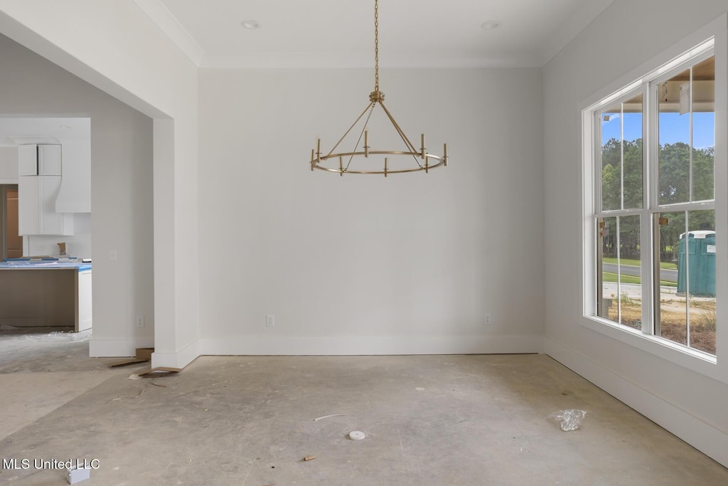 184 Harbor View Dr, Madison, MS 39110 - unfurnished dining area featuring a chandelier, healthy amount of natural light, crown molding, concrete floors, and baseboards