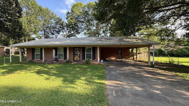 211 Boyd St, Ridgeland, MS 39157 - view of front facade featuring asphalt driveway, brick siding, a metal roof, and an attached carport