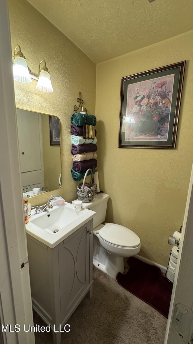 211 Boyd St, Ridgeland, MS 39157 - bathroom with vanity, a textured wall, and a textured ceiling