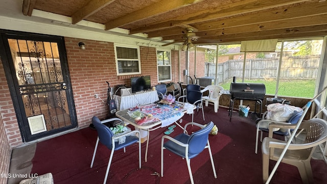 211 Boyd St, Ridgeland, MS 39157 - sunroom featuring outdoor dining space, ceiling fan, beam ceiling, and plenty of natural light
