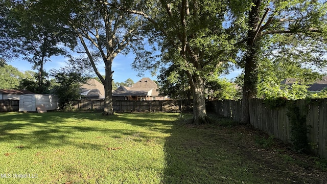 211 Boyd St, Ridgeland, MS 39157 - fenced backyard with a storage unit