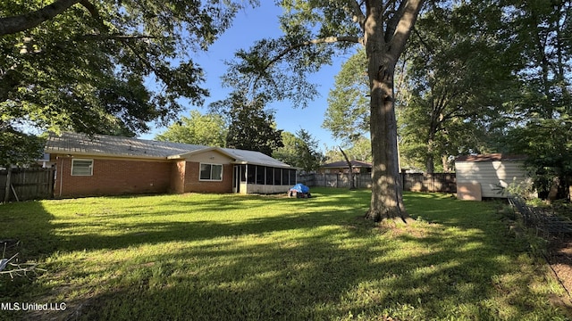 211 Boyd St, Ridgeland, MS 39157 - fenced backyard featuring a sunroom and a shed