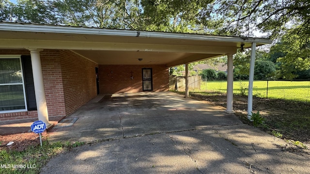 211 Boyd St, Ridgeland, MS 39157 - view of parking featuring driveway and an attached carport