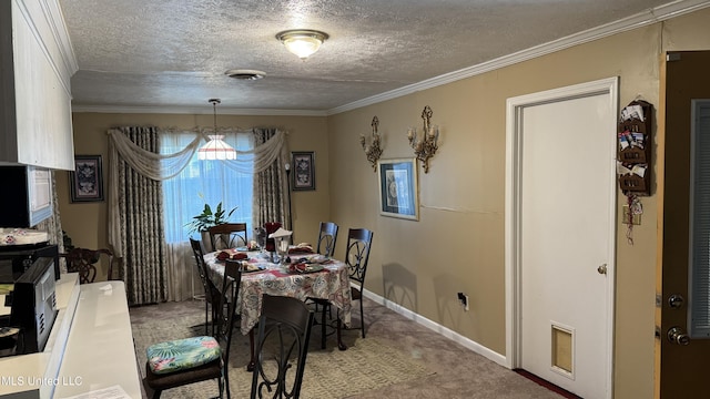 211 Boyd St, Ridgeland, MS 39157 - carpeted dining space with a textured ceiling and ornamental molding