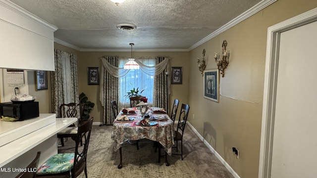 211 Boyd St, Ridgeland, MS 39157 - carpeted dining room with a textured ceiling and ornamental molding